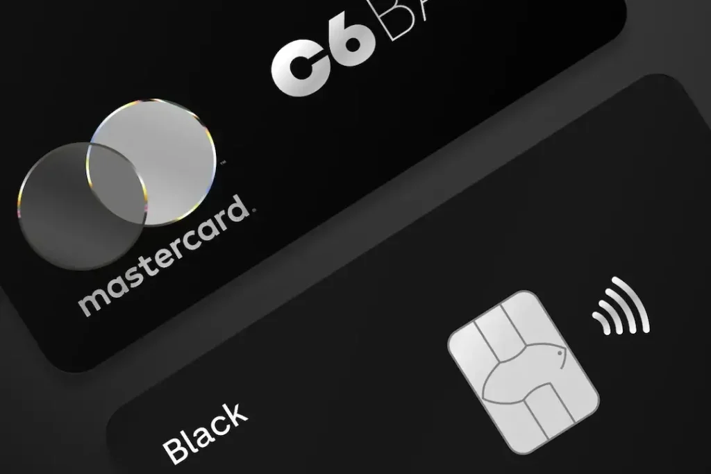 Cartão C6 Black Mastercard com benefícios premium, programa Átomos, acesso à sala VIP Mastercard Black Lounge e vantagens para viagens em 2026.